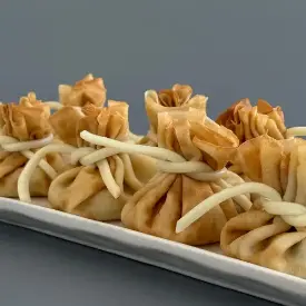 Закусочные блинные мешочки с сельдью